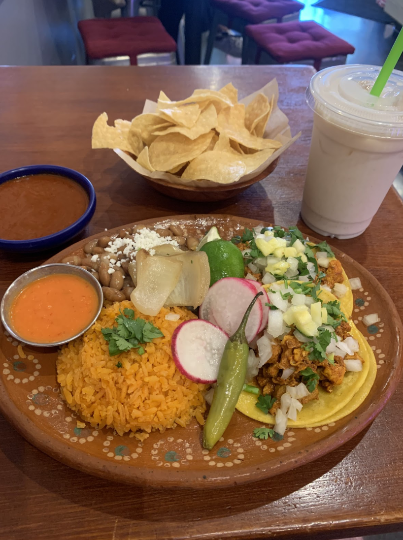 Two al pastor tacos with rice, beans and horchata at El Halal Amigos on June 12.